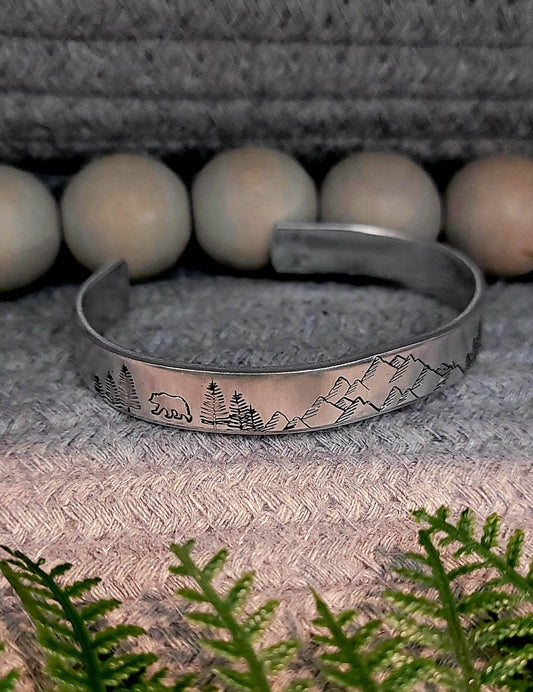 Hand stamped mountain scene aluminum cuff