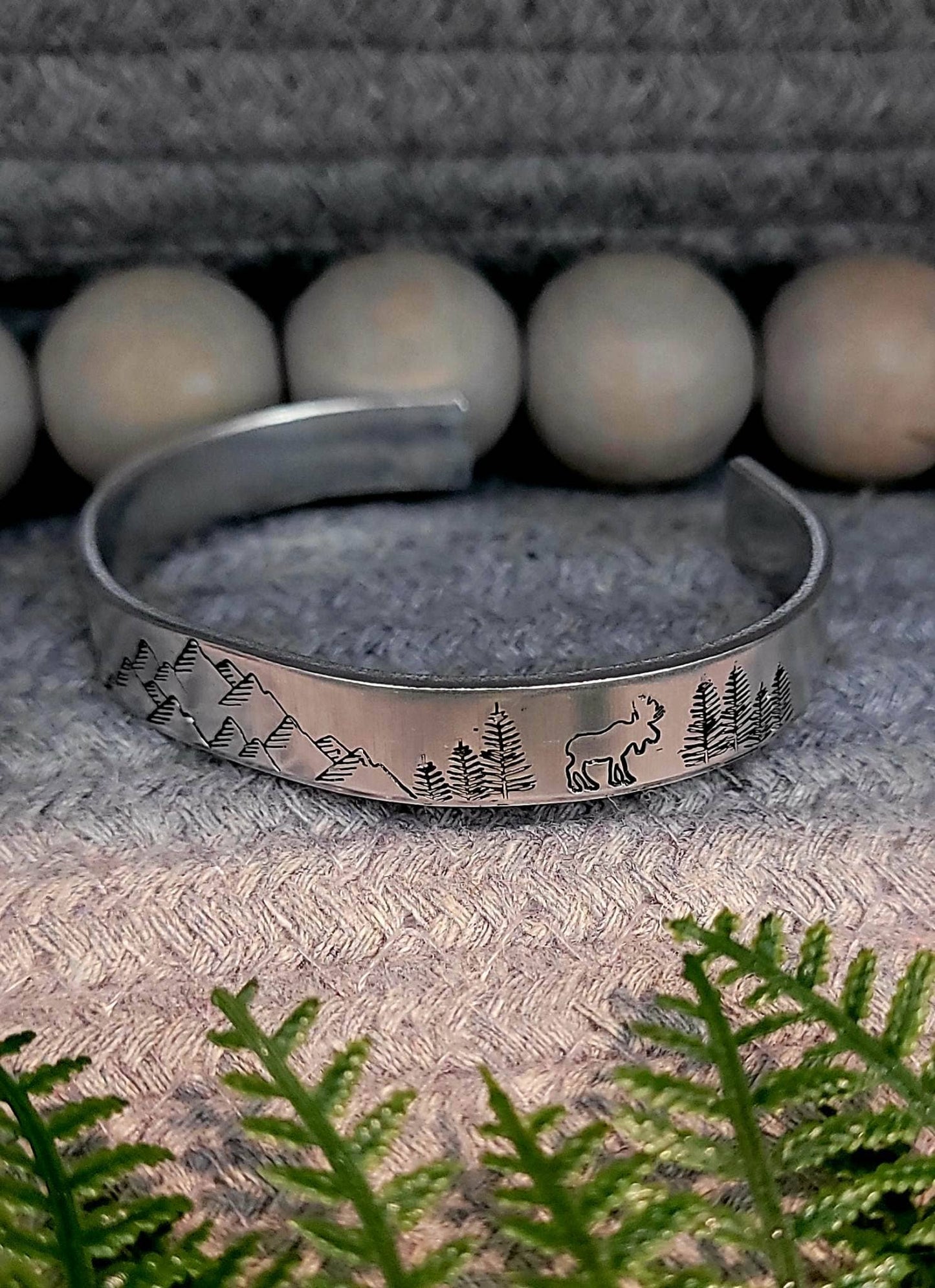 Hand stamped mountain scene aluminum cuff